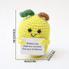 Handmade yellow crochet pocket hug doll with green hair and a white tag that reads Radiate joy embrace success live your bril