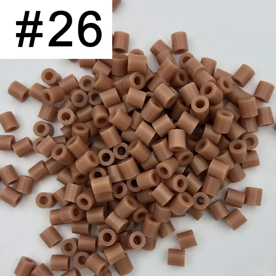A pile of 1000 assorted 5mm fuse beads in various brown and tan colors for craft projects.