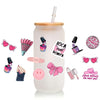 A clear cup with pink and black makeup-themed stickers, including lipstick, eyeshadow, and cosmetic bottles.