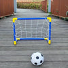 A portable soccer goal frame with a net and a ball are placed on a wooden deck.