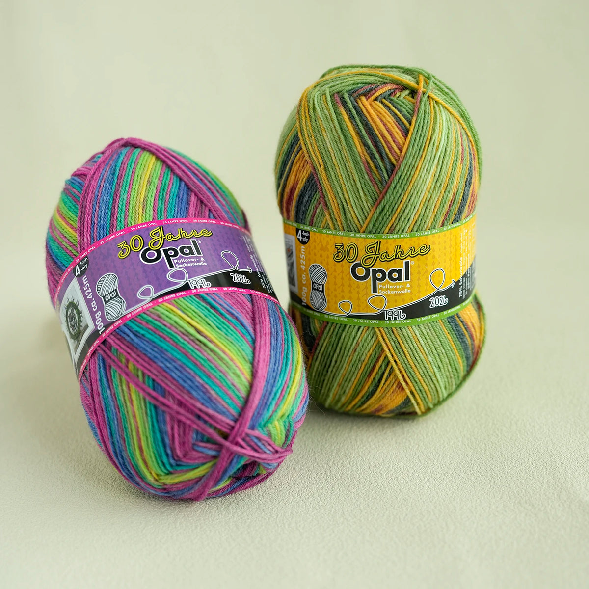 A ball of 30 Jahre Opal 4-ply sock yarn in multicolored threads, displayed against a light background.