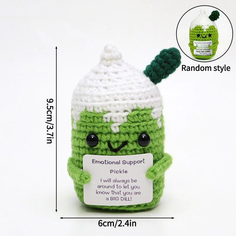 Handmade crochet pocket hug doll shaped like a green avocado with an inspirational support message