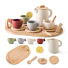 A wooden pretend play tea party set featuring various cups and a teapot for children.