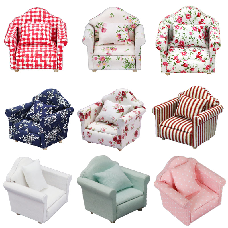A collection of various fabric upholstered mini sofas and armchairs in floral, plaid, and solid colors for dollhouses