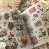 A close-up of a retro botanical sticker book featuring floral illustrations and vintage designs.