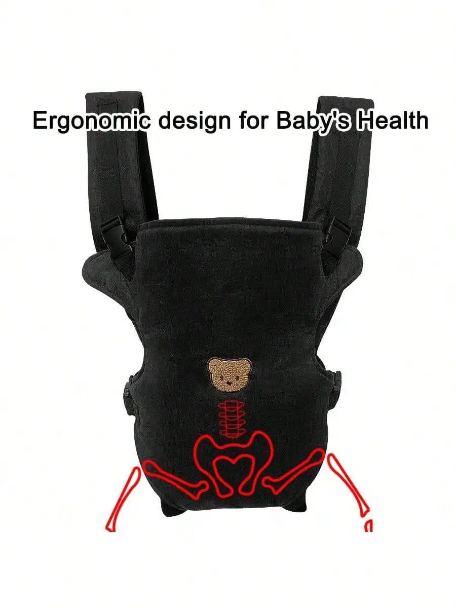 Black ergonomic baby carrier designed for baby's health with adjustable straps and a tooth graphic.