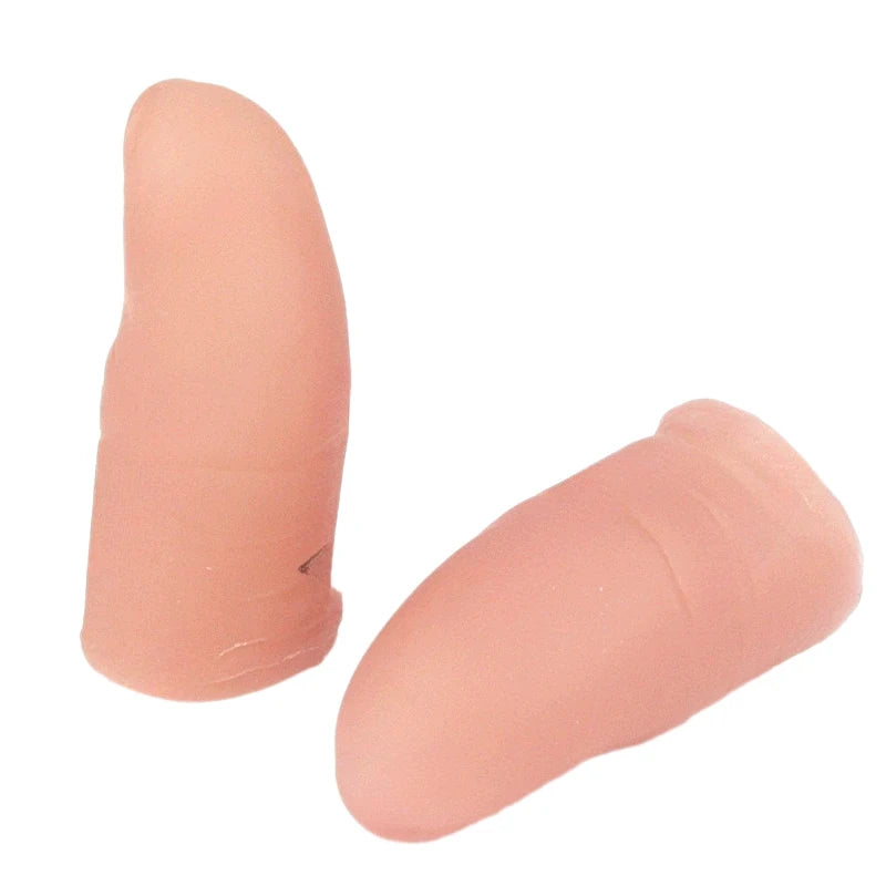 A realistic silicone fake thumb tip used for magic tricks, pink in color.