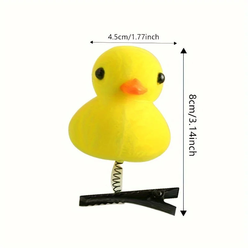 Yellow 3D duck plush hair clip with a small orange beak and black clip base