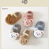 A collection of adorable cartoon bear baby booties in various soft colors and textures for infants.