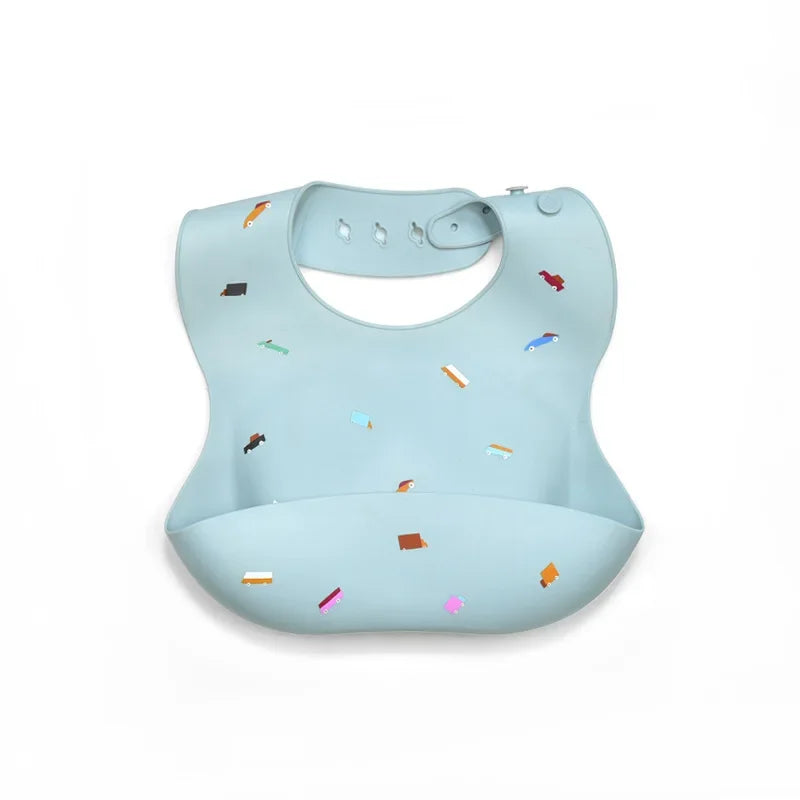 Light blue silicone baby bib with various colorful shapes and a strap for adjustable neck