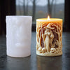 A lit silicone candle mold shaped like a witch portrait with a hat and flowing hair, set next to a white pillar candle.