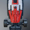 A detailed model of a formula racing car built from red and white plastic building blocks with steering and engine linkage co