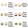 A collection of gold and silver plated beads including round discs, heart shapes, star shapes, and round beads.