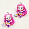 A set of 11 cartoon resin pendant charms featuring a pink-haired girl in purple and yellow attire.