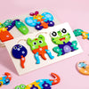 A set of wooden life cycle learning puzzles featuring colorful, stylized animals and elements for toddlers.