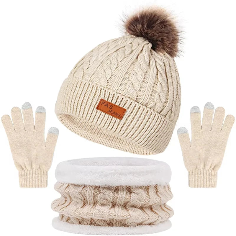 A set of women's knit winter hat, scarf, and gloves with a faux fur pom in beige color.