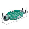 A portable tabletop foosball game featuring a green field and white goal, with black rods and scoring mechanisms.