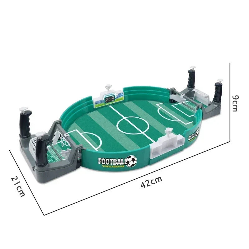 A portable tabletop foosball game featuring a green field and white goal, with black rods and scoring mechanisms.