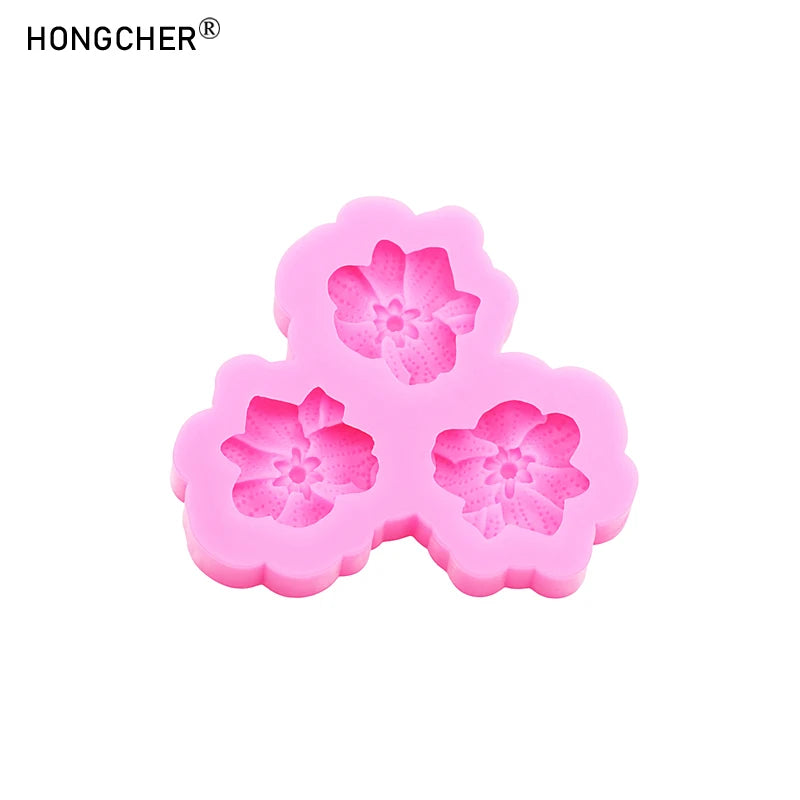 Pink silicone mold shaped like a peony or rose flower for resin, jewelry, and baking.