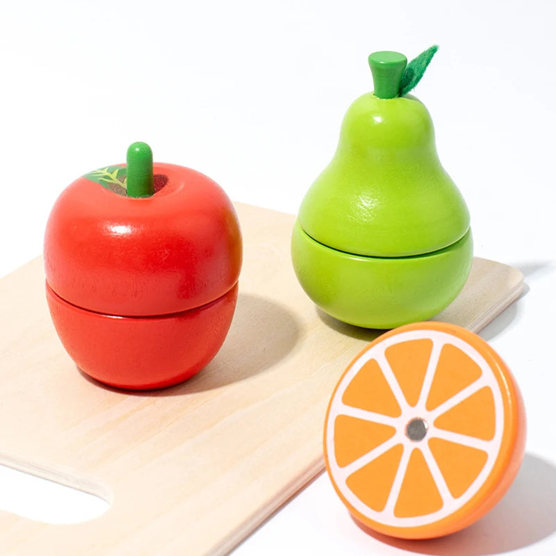A wooden magnetic fruit cutting play set featuring a red apple and a green pear.