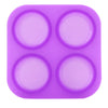 A purple silicone mold with four circular cavities for soap making or DIY crafts.
