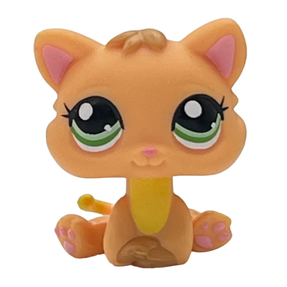 A charming bobble head pet figurine of an orange cat with large green eyes and light brown fur.