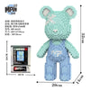 A light green building block set shaped like a bear, featuring a face and body components.