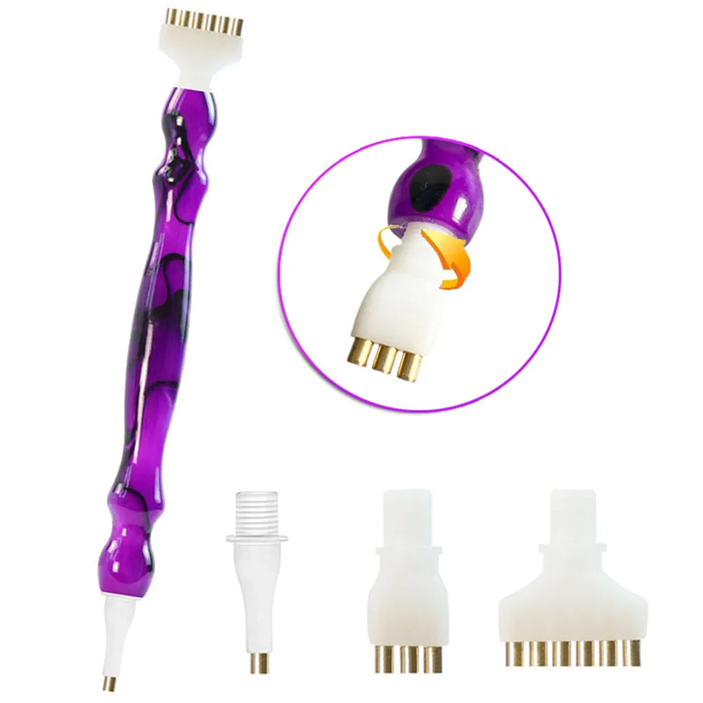 A set of diamond painting pens with interchangeable tips shown in purple and white.
