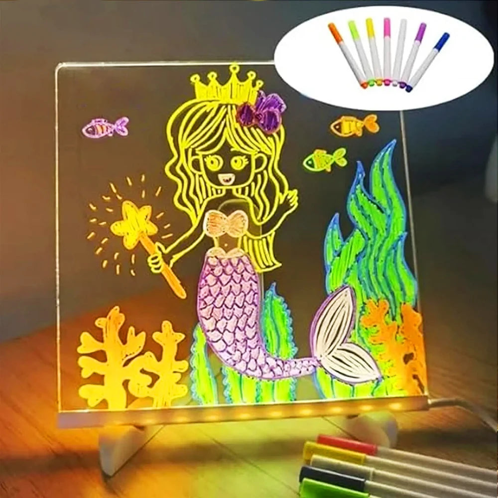 An LED acrylic message board featuring a princess design and seven colored pens.