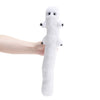 A white plush toy shaped like a witch hat with large eyes is being held by a person's hand.
