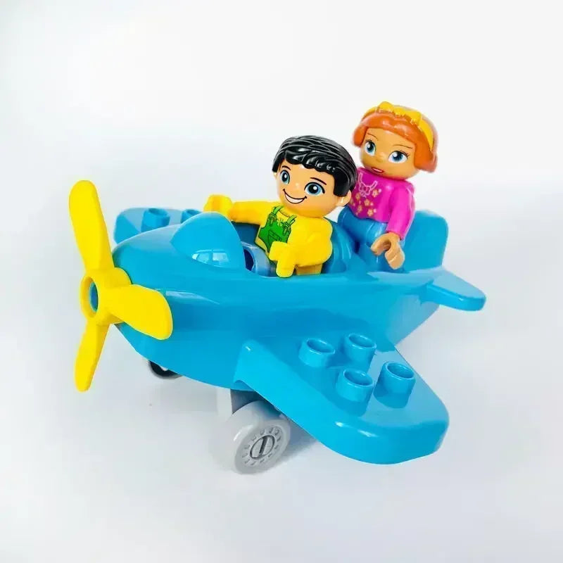 A set of blue city traffic vehicles, including a car and a bus, built from building blocks.