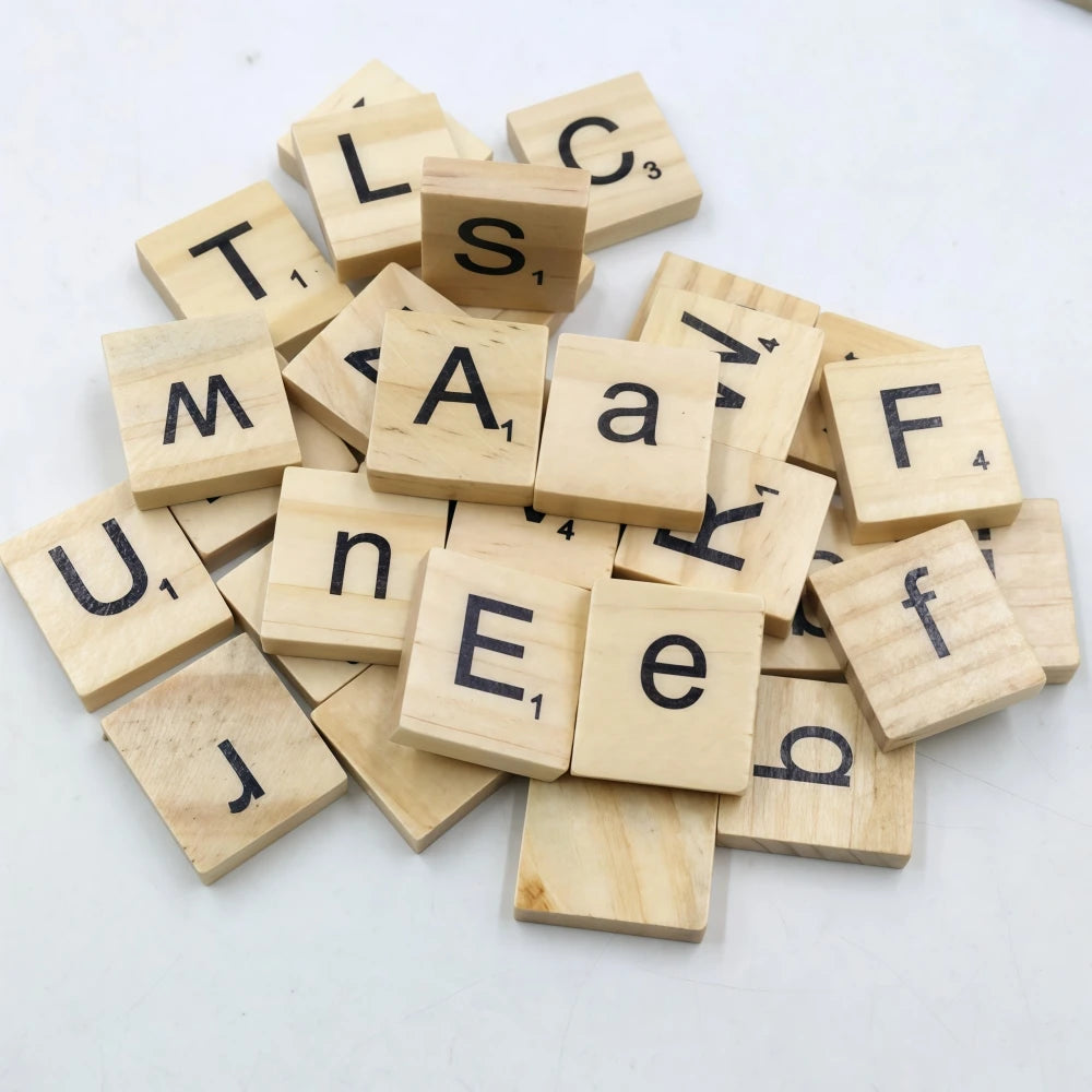 A collection of wooden alphabet letter tiles spelling out letters like T, L, S, E, F, J, and U, used for DIY crafts or games.
