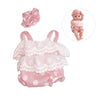 Pink lace romper outfit for a reborn doll with a matching bow and a photo of the doll.