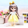 A 17cm articulated princess doll with long gray hair and a yellow dress, standing on a white surface.