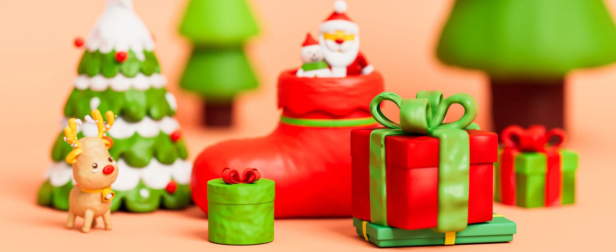 A festive arrangement of red boots, green Christmas trees, and wrapped gifts made from polymer clay.