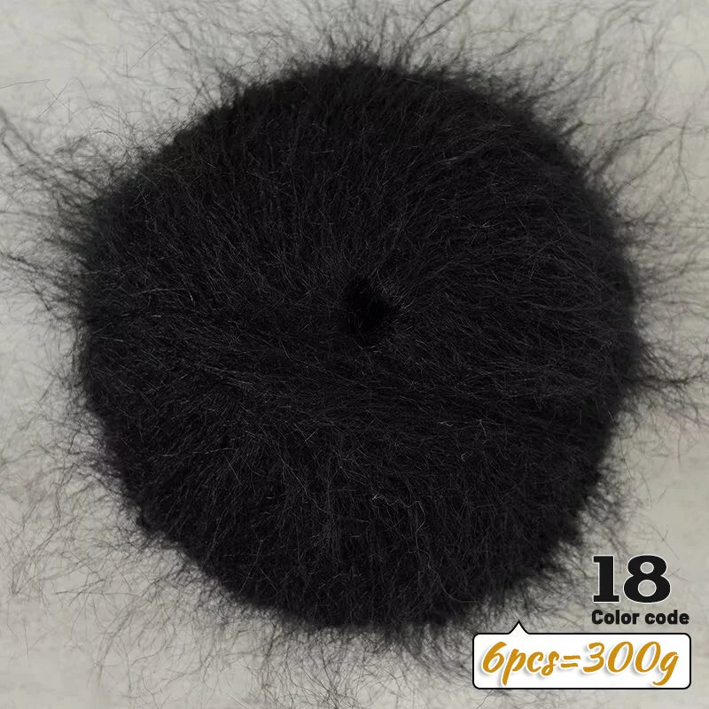 A dark black ball of long-haired alpaca blend yarn for knitting, labeled as 18 and weighing 300g.
