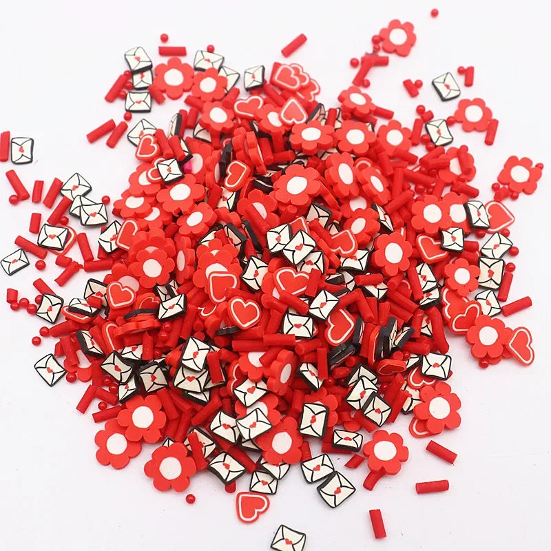 A pile of red polymer clay sprinkles mix used for slime decor and DIY craft accents.