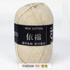 A ball of cream colored milk cotton yarn labeled with Chinese text and a price tag.