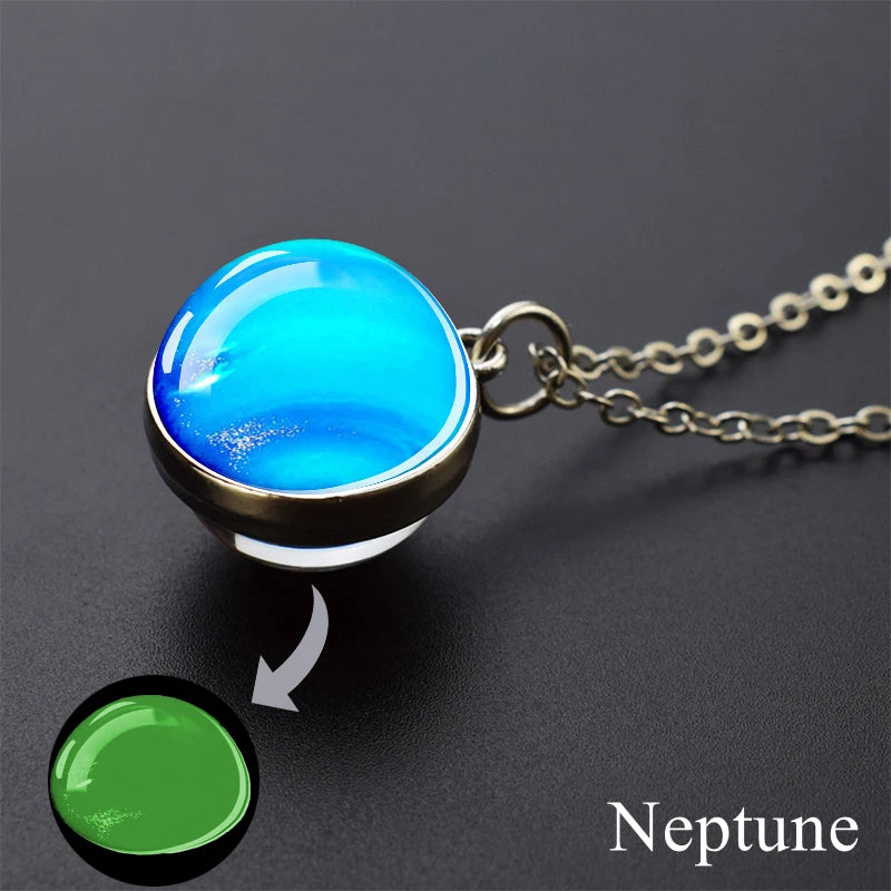 A pendant necklace featuring a bright blue, glow-in-the-dark sphere representing Neptune.