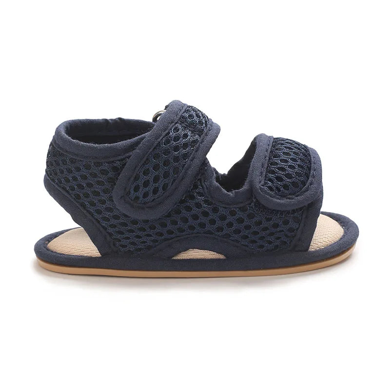 Navy breathable first walker sandals for baby with a soft sole and hook-and-loop closure