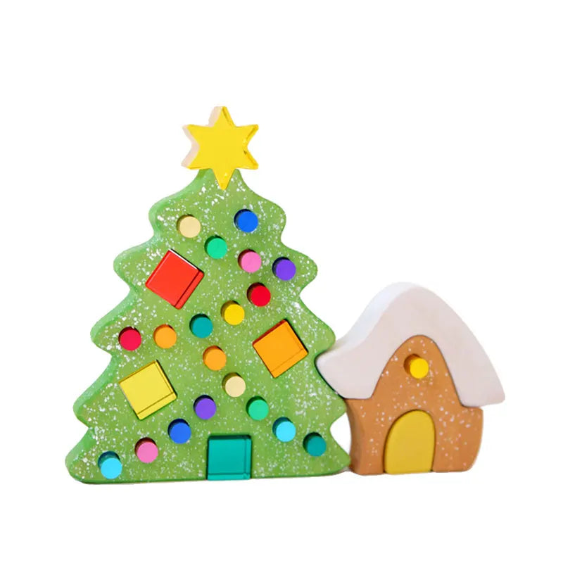 A green acrylic Christmas tree decoration with colorful round ornaments and a yellow star, next to a brown house block.