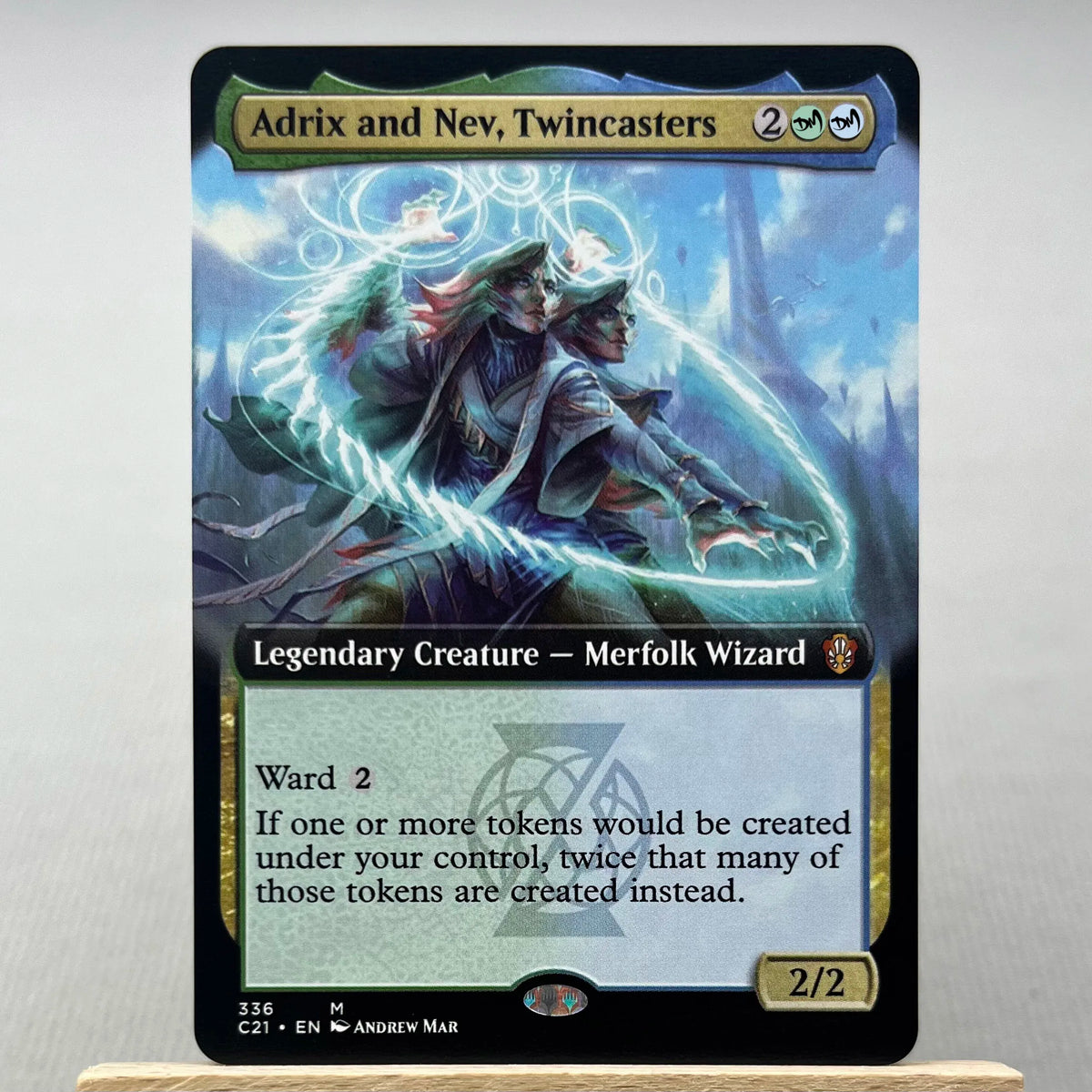 A Magic: The Gathering card featuring Adrix and Nev, Twincasters, a Legendary Creature, Merfolk Wizard, with a 2/2 power and 