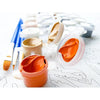 A collection of DIY paint by numbers tools including paint pots, brushes, and a canvas outline.