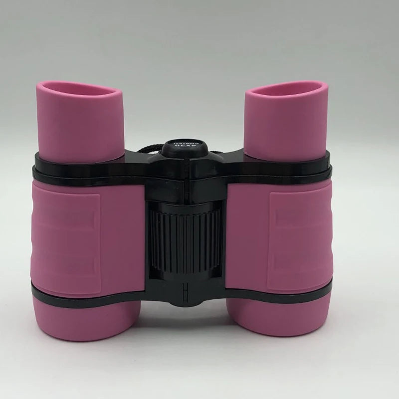 A pair of pink binoculars with black accents, designed for kids' bird watching and outdoor adventures.
