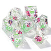 A set of seven pink floral butterfly resin polyhedral dice for tabletop role-playing games