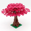 A model of a pink sakura cherry blossom tree built from interlocking plastic building blocks.
