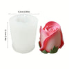 A pink silicone rose candle mold with green leaves shown next to its dimensions.