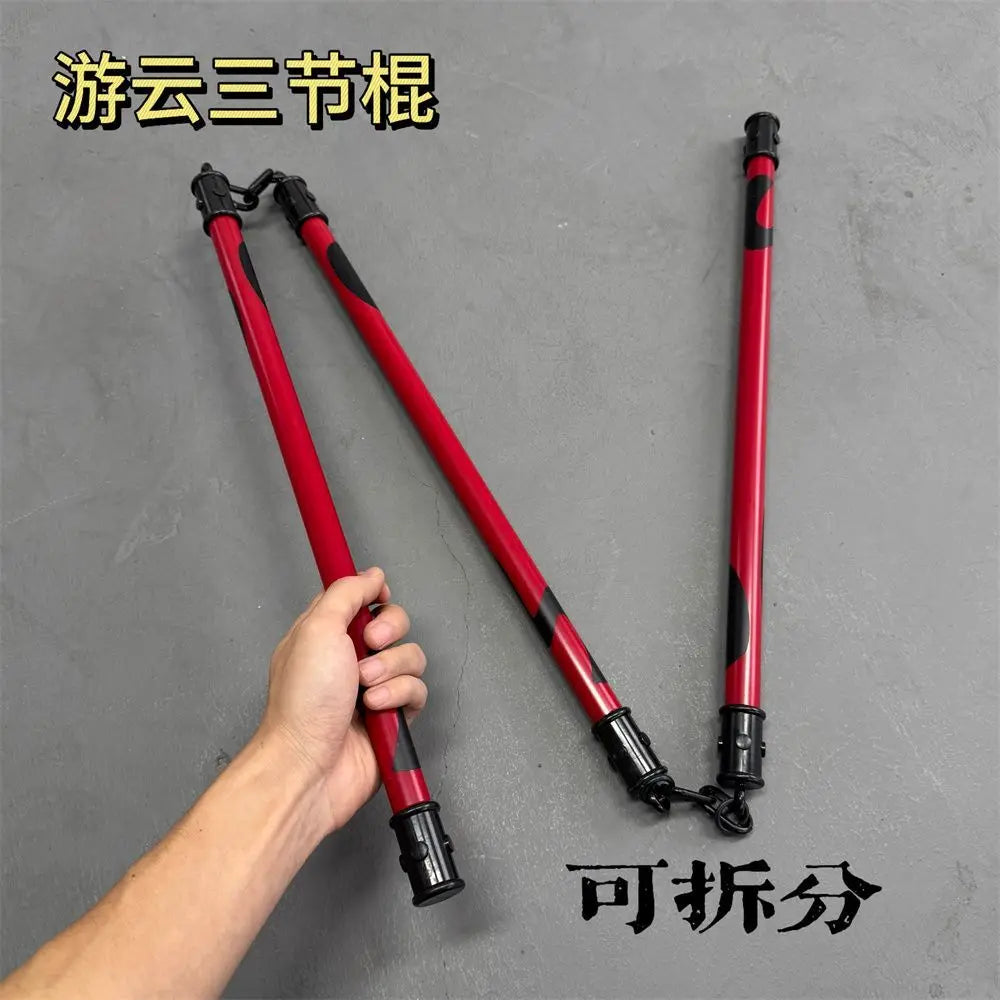 A pair of red and black cosplay props, likely for a character, are shown against a gray background.
