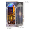 A wooden book nook kit featuring an arched window and warm LED lighting, displayed with dimensions 11.4cm by 17.5cm and a hei