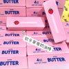 Pink squishy butter blocks with strawberry designs and the Strawberry Butter Squishy fidget toy